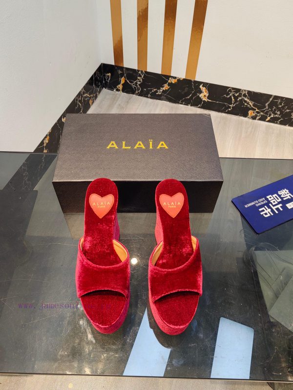 ALAIA's latest hate sky high water table slippers for 2024, with a unique heart-shaped desigbuxoruvy